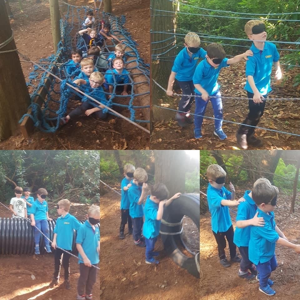 Image showing 1st Egham Beaver's section taking part in the Night Ropes challenge.  A blindfolded obstacle course of ropes and tires to negotiate.